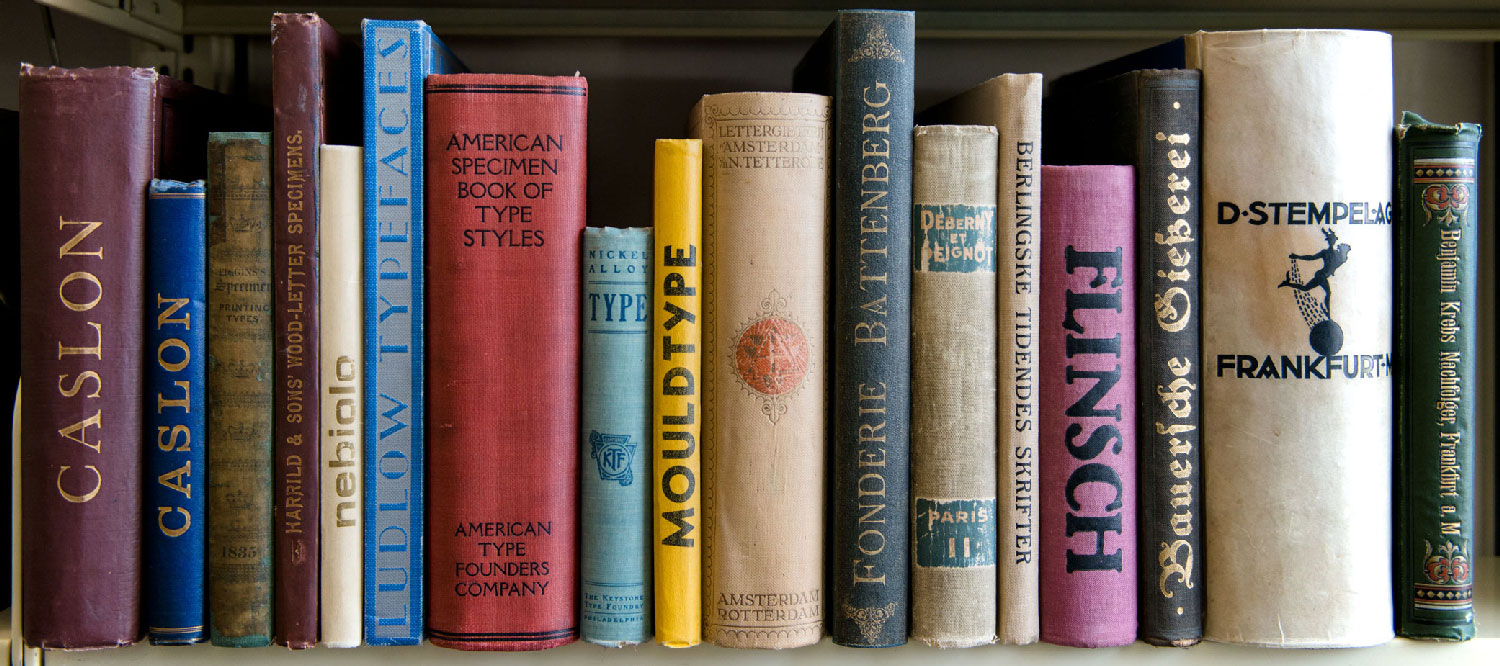 A shelf of bound type foundry specimen catalogs at Letterform Archive